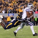 Kansas State's Tyler Lockett (16) is brought down by West Virginia's Karl Joseph during the second quarter of an NCAA college football game in Morgantown, W.Va., Saturday, Oct. 20, 2012. (AP Photo/Christopher Jackson)