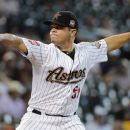 Houston Astros' Wandy Rodriguez delivers a pitch to the Chicago Cubs in the first inning of a baseball game Wednesday, May 23, 2012, in Houston. (AP Photo/Pat Sullivan)