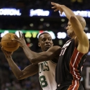 Boston Celtics forward Jeff Green (8), left, looks for an opening around Miami Heat forward Shane Battier (31), right, in the first half of an NBA basketball game at the TD Garden in Boston, Sunday, Jan. 27, 2013. (AP Photo/Steven Senne)
