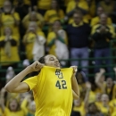 Baylor center Brittney Griner (42) celebrates after she scored 50 points during the second half of an NCAA college basketball game against Kansas State, Monday, March 4, 2013, in Arlington, Texas. Baylor won 90-68 and Griner marked a Big 12 single game scoring record. (AP Photo/LM Otero)