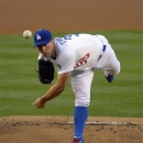 Los Angeles Dodgers starting pitcher Chris Capuano throws to the plate during the first inning of their baseball game against the San Diego Padres, Tuesday, April 16, 2013, in Los Angeles. (AP Photo/Mark J. Terrill)