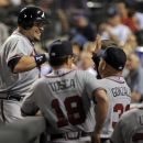 Atlanta Braves' Eric Hinske celebrates a two run home run off Colorado Rockies relief pitcher Edgmer Escalona with teammates during the 11th inning of a baseball game Friday, May 4, 2012, in Denver. (AP Photo/Jack Dempsey)