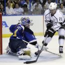 Los Angeles Kings' Anze Kopitar, of Slovenia, scores past St. Louis Blues goalie Brian Elliott, left, during the first period in Game 2 of an NHL hockey Stanley Cup second-round playoff series, Monday, April 30, 2012, in St. Louis. (AP Photo/Jeff Roberson)