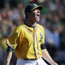 Oakland Athletics relief pitcher Sean Doolittle celebrates after striking out Texas Rangers' Josh Hamilton to end the eighth inning of a baseball game, Wednesday, Oct. 3, 2012, in Oakland, Calif. (AP Photo/Marcio Jose Sanchez)