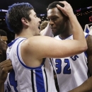 Saint Louis' Cody Ellis, left, celebrates with Cory Remekun after the NCAA college basketball game against the Virginia Commonwealth in the championships of the Atlantic 10 Conference tournament, Sunday March 17, 2013, in New York. Saint Louis beat Virginia Commonwealth 62-56. (AP Photo/Seth Wenig)