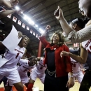 Rutgers head coach C. Vivian Stringer celebrates with her players on Tuesday, Feb. 26, 2013, in Piscataway, N.J., after defeating South Florida 68-56 in an NCAA college basketball game for Stringer's 900th win. (AP Photo/Mel Evans)