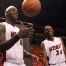Miami Heat basketball players LeBron James, left, and Ray Allen wait for their turn to have their pictures taken during the team's NBA media day in Miami, Friday, Sept. 28, 2012. (AP Photo/Wilfredo Lee)