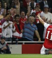 Arsenal's Andre Santos celebrates after scoring a goal against Olympiakos during their Champions League group F soccer match at the Emirates stadium, London, Wednesday Sept. 28, 2011.