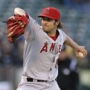 Los Angeles Angels' C.J. Wilson works against the Oakland Athletics during the first inning of a baseball game, Tuesday, May 22, 2012, in Oakland, Calif. (AP Photo/Ben Margot)