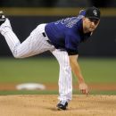 Colorado Rockies pitcher Tyler Chatwood throws against the Arizona Diamondbacks during the first inning of a baseball game, Monday, Sept. 24, 2012, in Denver. (AP Photo/Jack Dempsey)