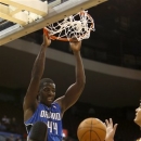 Orlando Magic's Andrew Nicholson (44) dunks the ball against Cleveland Cavaliers forward Anderson Varejao (17) during the second half of an NBA preseason basketball game, Monday, Oct. 15, 2012, in Cincinnati. The Cavaliers won in overtime, 114-111. (AP Photo/David Kohl)