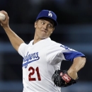 Los Angeles Dodgers starter Zack Greinke pitches to the Pittsburgh Pirates in the first inning of a baseball game in Los Angeles, Friday, April 5, 2013. (AP Photo/Reed Saxon)
