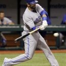 Toronto Blue Jays' Jose Bautista lines a two-run single off Tampa Bay Rays starting pitcher Matt Moore during the fifth inning of a baseball game, Tuesday, May 22, 2012, in St. Petersburg, Fla. Blues Jays' Kelly Johnson and Rajai Davis scored on the play. (AP Photo/Chris O'Meara)