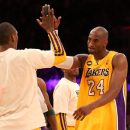 LOS ANGELES, CA - APRIL 09:  Kobe Bryant #24 of the Los Angeles Lakers high fives with Metta World Peace #15 after the game against the New Orleans Hornets  at Staples Center on April 9, 2013 in Los Angeles, California. The Lakers won 104-96.  (Photo by Stephen Dunn/Getty Images)
