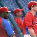 Philadlephia Phillies' Chase Utley, right, and Jimmy Rollins watch bating practice before the Phillies' baseball game against the Pittsburgh Pirates on Wednesday, June 27, 2012, in Philadelphia. (AP Photo/Michael Perez)