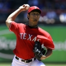 Texas Rangers starting pitcher Yu Darvish of Japan delivers to the Cincinnati Reds in the first inning of a baseball game Sunday, June 30, 2013, in Arlington, Texas. (AP Photo/Tony Gutierrez)