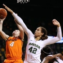 Baylor's Brittney Griner (42) pressures Oklahoma State's Liz Donahoe (4) during the first half of their NCAA college basketball game, Sunday, Jan. 6, 2013, in Waco, Texas. (AP Photo/The Waco Tribune-Herald, Rod Aydelotte)