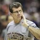 FILE - This March 31, 2012 file photo shows Connecticut head coach Geno Auriemma watching practice at the NCAA Women's Final Four college basketball tournament in Denver. Auriemma has generated a lot of buzz with his suggestion this week that the rims be lowered in women's basketball to help make the game more attractive to fans. (AP Photo/Eric Gay, File)