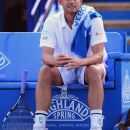 EASTBOURNE, ENGLAND - JUNE 22:  Andy Roddick of USA waits as his opponent Steve Darcis of Belgium receives treatment before retiring in the semi final of the AEGON International at Devonshire Park  on June 22, 2012 in Eastbourne, England.  (Photo by Mike Hewitt/Getty Images)