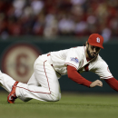 St. Louis Cardinals' Matt Carpenter can't catch a ball hit by Boston Red Sox's Jacoby Ellsbury during the fourth inning of Game 3 of baseball's World Series Saturday, Oct. 26, 2013, in St. Louis. (AP Photo/Jeff Roberson)