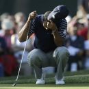 USA's Tiger Woods pauses on the 11th green during a four-ball match at the Ryder Cup PGA golf tournament Saturday, Sept. 29, 2012, at the Medinah Country Club in Medinah, Ill. (AP Photo/David J. Phillip)