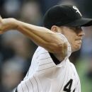 Chicago White Sox starter Jake Peavy throws against the Seattle Mariners during the first inning of a baseball game in Chicago, Friday, June 1, 2012. (AP Photo/Nam Y. Huh)