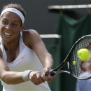 Madison Keys of United States returns the ball as she plays Agnieszka Radwanska of Poland in a Women's singles match at the All England Lawn Tennis Championships in Wimbledon, London, Saturday, June 29, 2013. (AP Photo/Alastair Grant)
