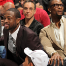 MIAMI, FL - APRIL 6:  Chris Bosh #1 and Dwyane Wade #3 of the Miami Heat look on from the bench during a game between the Philadelphia 76ers and the Miami Heat on April 6, 2013 at American Airlines Arena in Miami, Florida. (Photo by Issac Baldizon/NBAE via Getty Images)