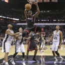 Miami Heat's Chris Bosh (1) dunks against the San Antonio Spurs during the first half at Game 4 of the NBA Finals basketball series, Thursday, June 13, 2013, in San Antonio. (AP Photo/Eric Gay)
