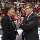 CORRECST SPELLING OF COACHES NAMES - Connecticut head coach Geno Auriemma, right, talks with Stanford head coach Tara VanDerveer before the start of their NCAA college basketball game in Stanford, Calif., Saturday, Dec. 29, 2012. (AP Photo/Tony Avelar)