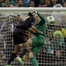 Mexico's Jesus Zabala, left, collides with United States goalkeeper Brad Guzan while trying to score during a 2014 World Cup qualifying match at the Aztec stadium in Mexico City, Tuesday, March 26, 2013. (AP Photo/Eduardo Verdugo)