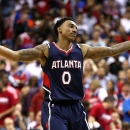 WASHINGTON, DC - MAY 11: Jeff Teague #0 of the Atlanta Hawks celebrates after hitting a shot against the Washington Wizards during the second half in Game Four of the Eastern Conference Semifinals of the 2015 NBA Playoffs at Verizon Center on May 11, 2015 in Washington, DC. The Atlanta Hawks won, 106-101. (Photo by Patrick Smith/Getty Images)