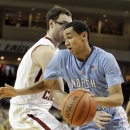 North Carolina's Marcus Paige (5) drives against Boston College's Andrew Van Nest (15) during the first half of an NCAA college basketball game in Boston, Tuesday, Jan. 29, 2013. (AP Photo/Mary Schwalm)