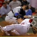 Boston Red Sox's Jacoby Ellsbury, front, scores on a double hit by Carl Crawford as Texas Rangers catcher Mike Napoli, rear, waits for the ball in the eighth inning of a baseball game at Fenway Park in Boston, Monday, Aug. 6, 2012. (AP Photo/Steven Senne)