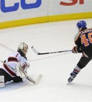 New Jersey Devils goalie Johan Hedberg (1) blocks a penalty shot by New York Islanders ' Michael Grabner (40) in the third period of an NHL hockey game, Friday, Nov. 25, 2011, in Uniondale, N.Y. The Devils won 1-0.