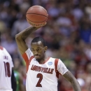 Louisville guard Russ Smith (2) reacts during the second half of a regional semifinal against Oregon in the NCAA college basketball tournament, Friday, March 29, 2013, in Indianapolis. Louisville won 77-69. (AP Photo/Michael Conroy)