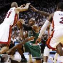 File - In this June 5, 2012, file photo, Boston Celtics' Ray Allen (20) looks to pass the ball as Miami Heat's Shane Battier (31) and Dwyane Wade (3) defend during the second half of Game 5 in their NBA basketball Eastern Conference Finals playoff series in Miami. Allen told the Heat on Friday night, July 6, 2012, that he has decided to leave the Celtics and join up with the reigning NBA champions. (AP Photo/Lynne Sladky, File)