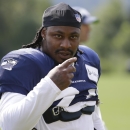 FILE -In this Aug. 2, 2014, file photo, Seattle Seahawks running back Marshawn Lynch walks on the field during NFL football training camp in Renton, Wash. Police in Bellevue, Washington, are investigating whether Lynch was involved in an assault and damage of personal property. The Bellevue Police Department released a statement Monday morning, Aug. 11, 2014, saying that the alleged incident took place around 2:30 a.m. Sunday and that Lynch is alleged to have been involved. (AP Photo/Ted S. Warren, File)