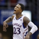 Kansas guard Ben McLemore celebrates a 3-point basket during the second half of an NCAA college basketball game against Baylor in Lawrence, Kan., Monday, Jan. 14, 2013. Kansas defeated Baylor 61-44. (AP Photo/Orlin Wagner)