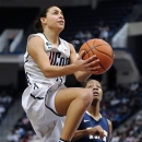 Connecticut's Bria Hartley, left, drives to the basket as Pittsburgh's Asia Logan, right, defends during the first half of an NCAA college basketball game in Hartford, Conn., Tuesday, Feb. 26, 2013. (AP Photo/Jessica Hill)