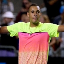 Nick Kyrgios of Australia celebrates after defeating Andreas Seppi of Italy in their fourth round match at the Australian Open tennis championship in Melbourne, Australia, Sunday, Jan. 25, 2015. (AP Photo/Rob Griffith)