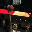 Maryland forward Alyssa Thomas goes to the basket over Virginia guard Ataira Franklin during the first half of an NCAA college basketball game in Charlottesville, Va., Sunday, Feb. 17, 2013. (AP Photo/Norm Shafer)