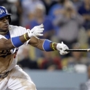 Los Angeles Dodgers' Yasiel Puig hits a two-RBI single against the Philadelphia Phillies in the eighth inning during a baseball game Thursday, June 27, 2013, in Los Angeles. (AP Photo/Alex Gallardo)