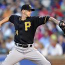 Pittsburgh Pirates' A.J. Burnett pitches against the Chicago Cubs during the first inning of a baseball game Tuesday, July 31, 2012, in Chicago. (AP Photo/Jim Prisching)