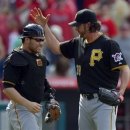 Pittsburgh Pirates catcher Russell Martin, left, and relief pitcher Jason Grilli celebrate after they defeated the Los Angeles Angels 10-9 in their baseball game, Sunday, June 23, 2013, in Anaheim, Calif. (AP Photo/Mark J. Terrill)