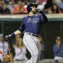 Tampa Bay Rays' James Loney watches his ball after hitting a two-run home run off Cleveland Indians relief pitcher Scott Barnes in the third inning of a baseball game, Saturday, June 1, 2013, in Cleveland. Evan Longoria scored. (AP Photo/Tony Dejak)