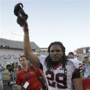 Georgia linebacker Jarvis Jones tips his hat to fans as he leaves the field after defeating Nebraska 45-31 in the Capital One Bowl NCAA football game, Tuesday, Jan. 1, 2013, in Orlando, Fla. (AP Photo/John Raoux)