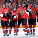 Ottawa Senators' Daniel Alfredsson, Cory Conacher, Erik Karlsson, Milan Michalek and Sergei Gonchar celebrate their team's tying goal against the Montreal Canadiens during the third period of Game 4 of an NHL hockey Stanley Cup playoff series, in Ottawa, Ontario, on Tuesday, May 7, 2013. (AP Photo/The Canadian Press, Sean Kilpatrick)