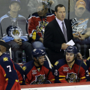 Florida Panthers coach Kevin Dineen, right, watches his team during the third period of a preseason NHL hockey game against the Dallas Stars, Friday, Sept. 20, 2013, in San Antonio. Dallas won 4-1. (AP Photo/Eric Gay)