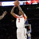Louisville's Russ Smith (2) shoots during the first half of an NCAA college basketball game against Villanova at the Big East Conference tournament, Thursday, March 14, 2013, in New York. (AP Photo/Frank Franklin II)